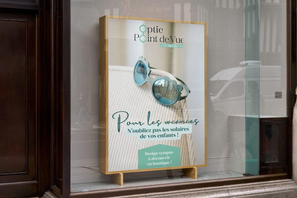 affiche de l'enseigne optic point de vue, un support de communication crée par l'agence com commerce en auvergne